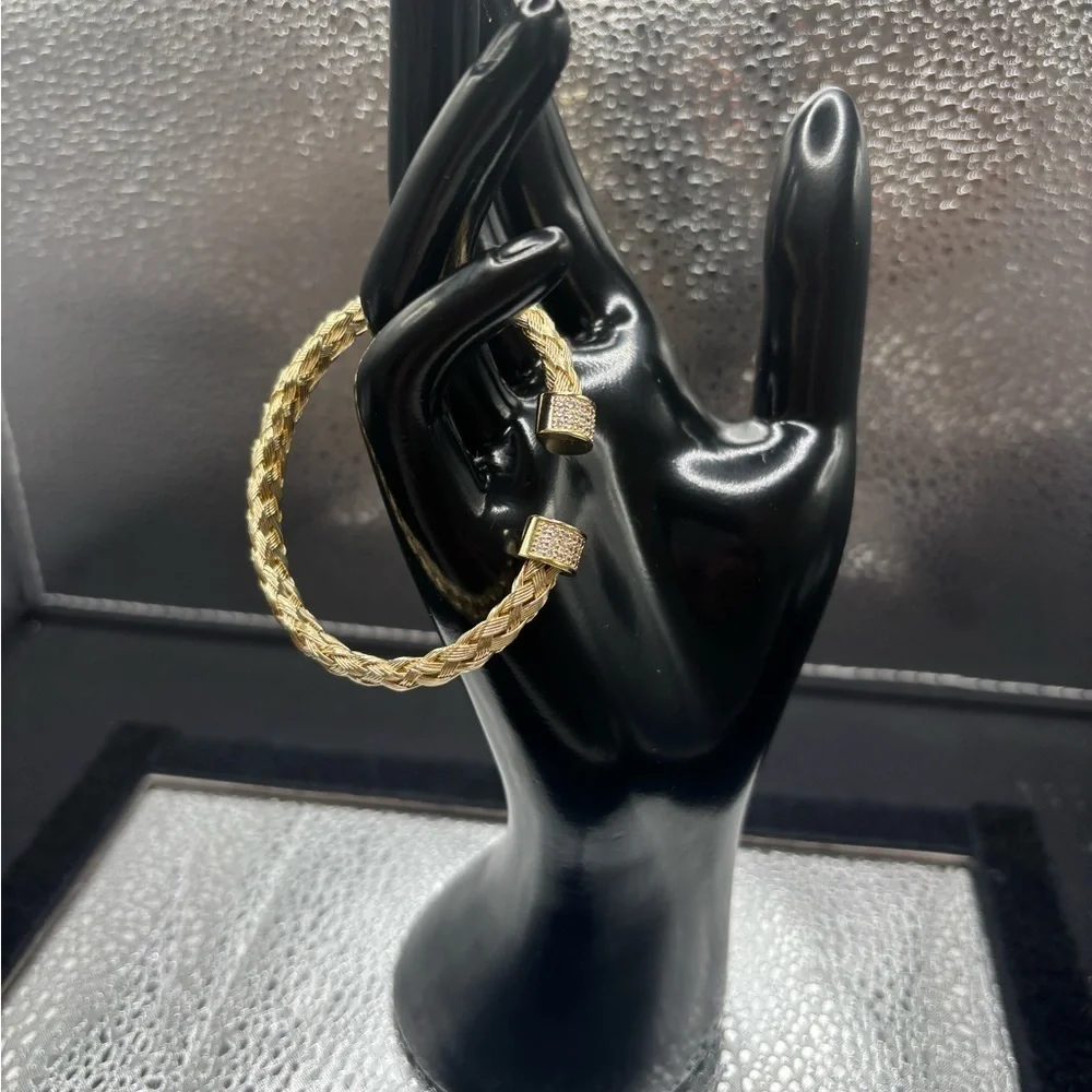 Elegant Gold Braided Also Adjustable Bangle .